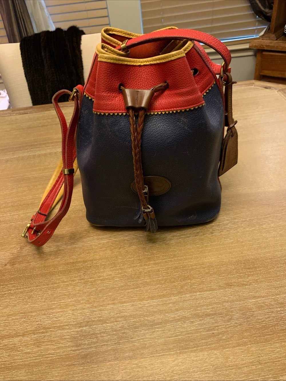 Dooney & Bourke Navy, Red & Yellow Leather Drawstring Bucket Bag